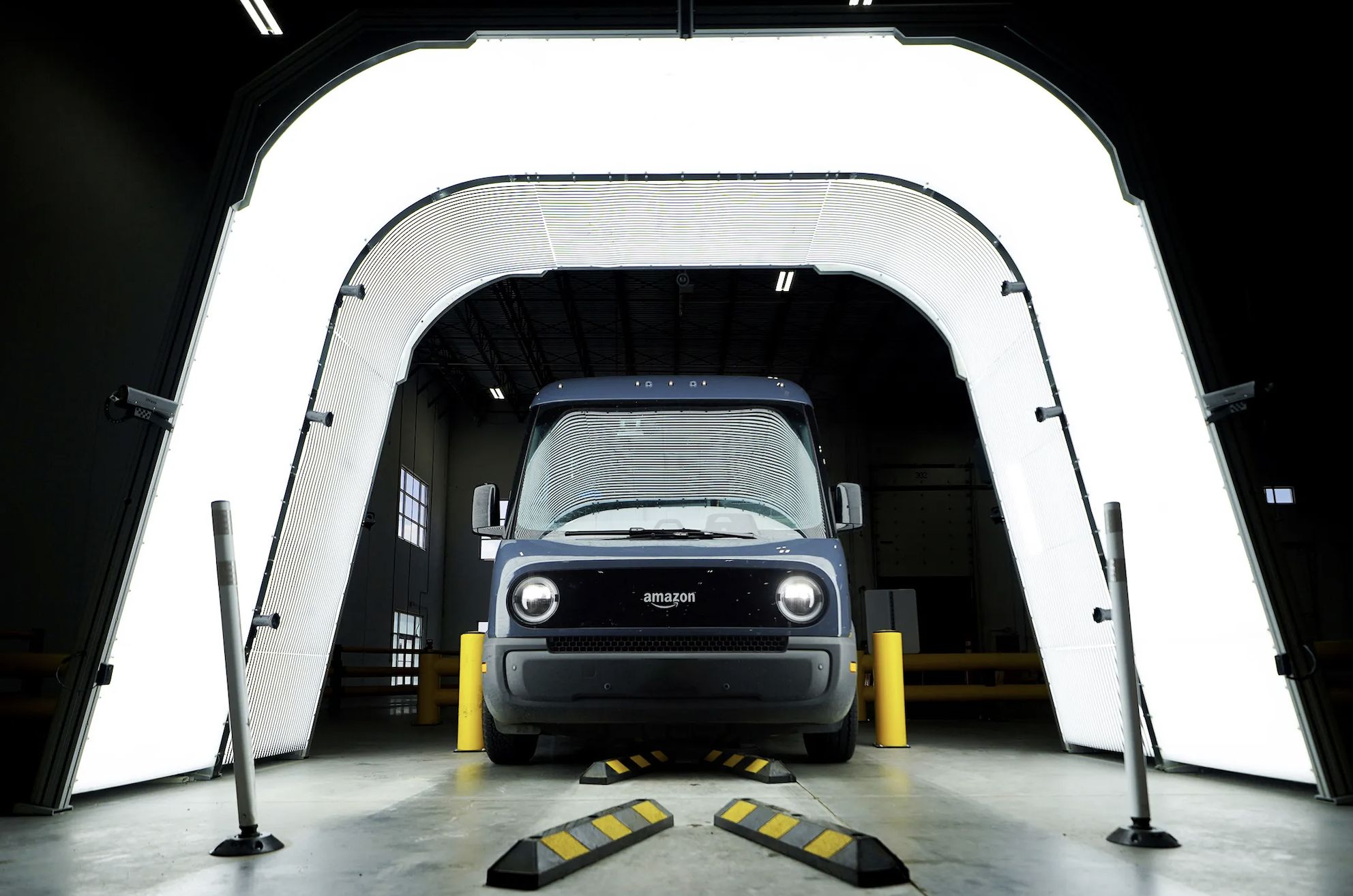 Amazon delivery van inside an automated vehicle inspection tunnel